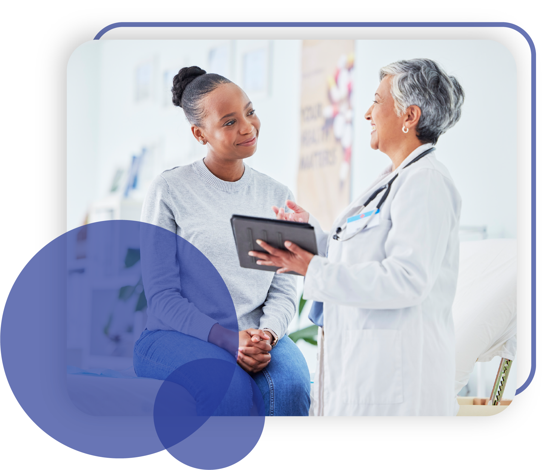 doctor with ipad speaking to smiling patient